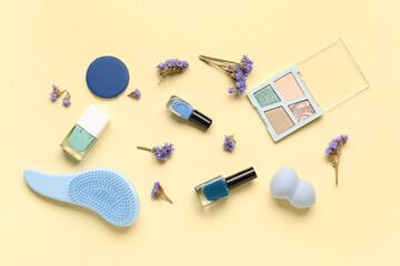 Composition with makeup products and beautiful gypsophila flowers on beige background