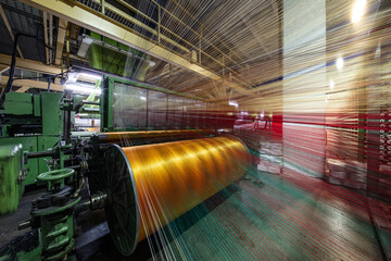Synthetic yarns for carpet factory, carpet production, weaving looms. Interior of a Carpet Weaving...