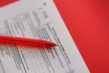 Indonesian tax form 1770 Individual Income Tax Return and pen on table close up