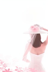 Wedding image, brunette, Asian woman in a white wedding dress and hat. copy space