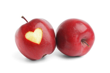 Fresh red apple with carved heart on white background