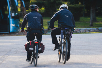 Police squad formation on duty riding bike and bicycle, maintain public order in the european city...