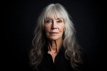 Portrait of a beautiful senior woman with grey hair on black background - obrazy, fototapety, plakaty