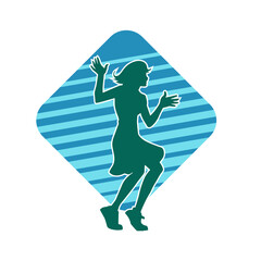 Silhouette of a female dancer in action pose. Silhouette of a slim woman in dancing pose.