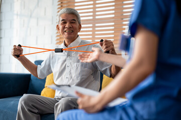 Asian senior elderly man doing physiotherapist with support from nurse.  - obrazy, fototapety, plakaty