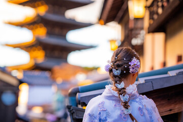 Travel, A young female tourist wears a beautiful kimono, the Japanese national costume. walking at Yasaka Pagoda and Sannen Zaka Street in Kyoto Japan, Yasaka Pagoda is the famous landmark and travel 