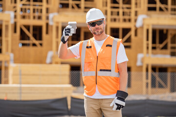 Coffee, engineer and construction worker relax on break at construction site. handsome male builder...