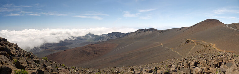 Fototapeta premium Haleakala volcano crater panoramic view with clouds below on Maui, Hawaii 
