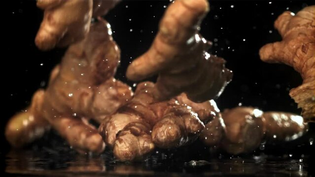 Fresh ginger falls on the table. Filmed on a high-speed camera at 1000 fps. High quality FullHD footage