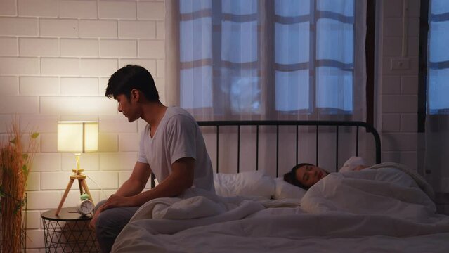 Asian young couple on bed. depression and erectile dysfunction. Man and woman with stress, sex problems or anxiety in relationship difficulties. Marriage and divorce problem concept