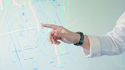 close up of hand pointing.Financial technology. Stock trading and investments. Business and financial concepts. 