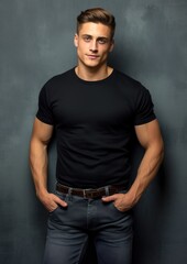 Obraz premium young male model in a black T-shirt on a gray background