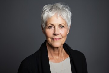 Portrait of a beautiful senior woman with grey hair. Studio shot.