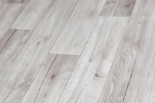 Gray wooden board pattern on linoleum surface