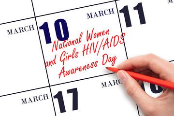 March 10. Hand writing text National Women and Girls HIV AIDS Awareness Day on calendar date. Save...