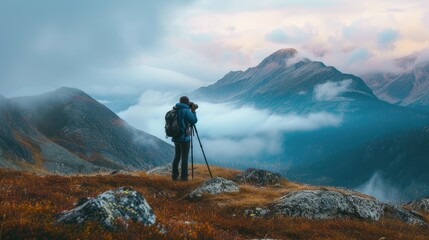 Professional photographer taking picture with modern camera in mountains.