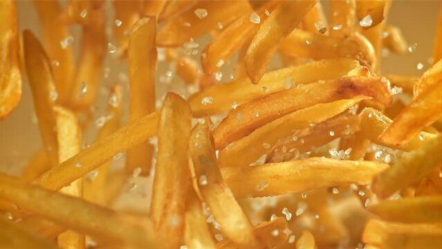 French fries fly up and fall down. Filmed on a high-speed camera at 1000 fps. High quality FullHD footage