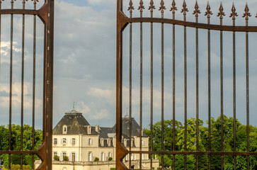 An open gate to a chateau in Meursault, France.