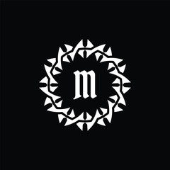Initial letter M ornamental border circle frame logo