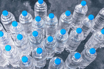 Group of PET plastic bottles of drinking water in water plant factory