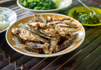 Fried fish with rice and vegetables on, ndonesian cuisine, Indonesian food