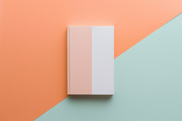 mockup of a notebook with double color between white and peach fuzz. notebook concept. - obrazy, fototapety, plakaty