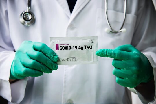 Doctor show rapid antigen test Covid -19 self repid test set