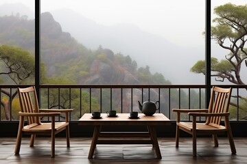 On the open-air veranda, the breathtaking mountain view unfolds in the morning mist, creating a serene ambiance complemented by a rustic wood table and chairs.