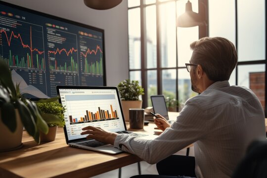 Focused analyst evaluating financial data on computer screens