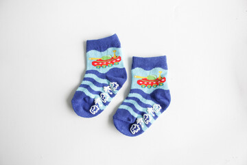 a pair blue baby sock on white background