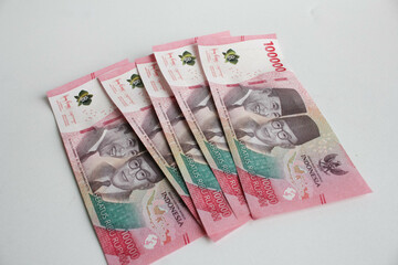 Cash payment concept. Indonesian rupiah currency (Rp. 100.000 Seratus Ribu Rupiah), One hundred thousand Indonesian rupiah money.
