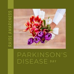 Composition of parkinson's disease day text over woman holding bunch of multi coloured tulips
