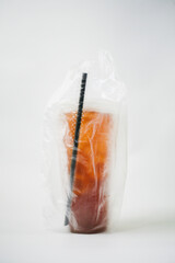 Take away iced tea with plastic bag isolated on white background