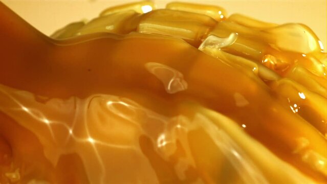 The juice flows through the sliced mango fruit. Filmed on a high-speed camera at 1000 fps. High quality FullHD footage