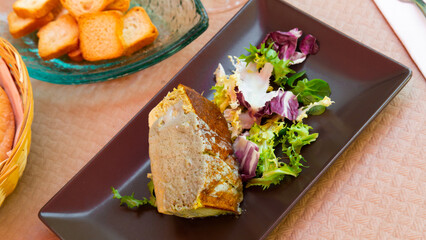 Plate of tasty spanish tapas - Leek pie served with greens