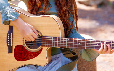 Nature, camp and closeup of girl with guitar for entertainment, talent or music in woods or forest....