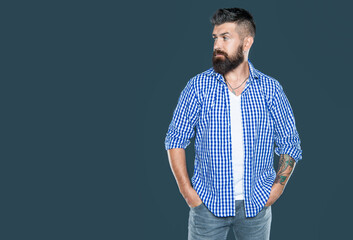 amazed bearded man wear checkered shirt on grey background