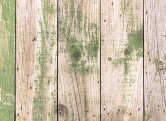 Old wooden boards in green paint as an abstract background. Texture