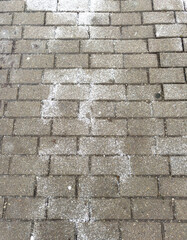 Snowflakes on paving slabs. Background