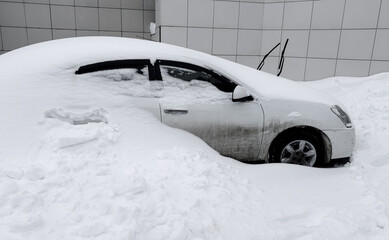 Car covered with white snow