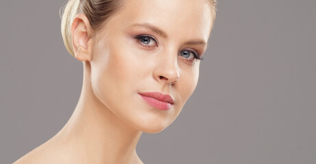 Close-up portrait of beautiful, fresh, healthy and sensual girl over grey background