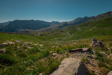 Afternoon view from sedlo or saddle at Durmitor, mountain pass between Zabljak and Savnik. Picturesque view with stones and long green valley