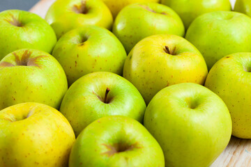 Many of ripe green apples on the wooden table. High quality photo