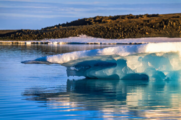 Melting ice floe at the coast in arctic © Lars Johansson