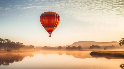 Obraz premium A colorful hot air balloon soaring over a scenic landscape