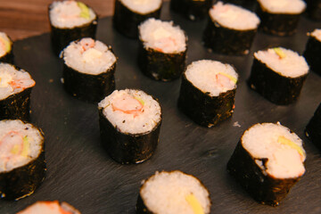 japanese sushi food. Maki ands rolls with tuna, salmon, shrimp, crab and avocado, High quality photo