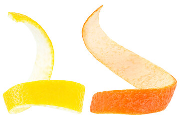 Juicy citrus peels isolated on a white background. Lemon and orange twist.