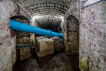 A water pipe in an old basement.