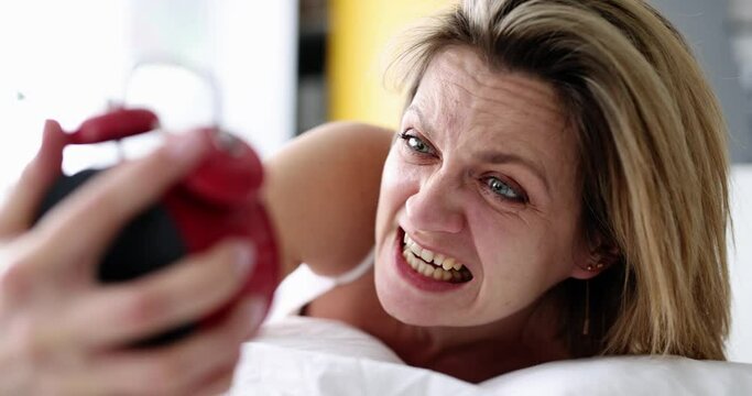 Awakening sleeping woman overslept for work. Late for work and sound sleep concept