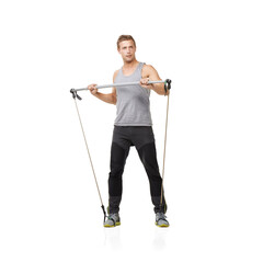 Gym, fitness and resistance band with a strong man in studio isolated on a white background for health. Idea, exercise or performance and a young athlete training with equipment for wellness